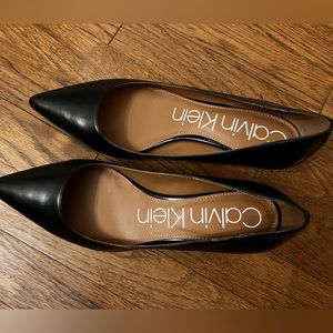 Calvin Klein kitten heel pumps with gold accents at the back.Size 9